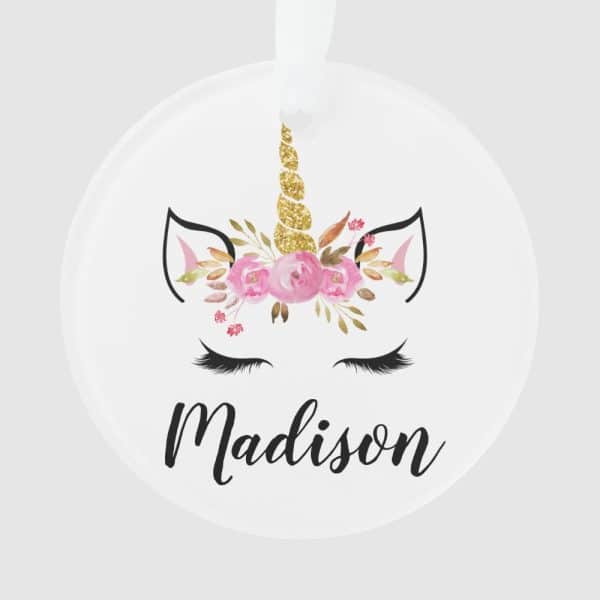 Round Ornament Featuring A Unicorn Face With A Gold Glitter Horn And Pink Flowers, Personalized With The Name Madison.
