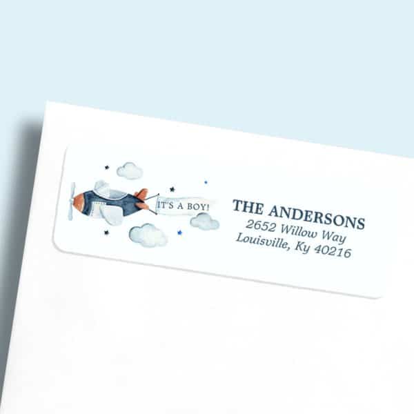 Baby Boy Birth Announcement Return Address Label Featuring A Watercolor Airplane With A Banner Reading Its A Boy.