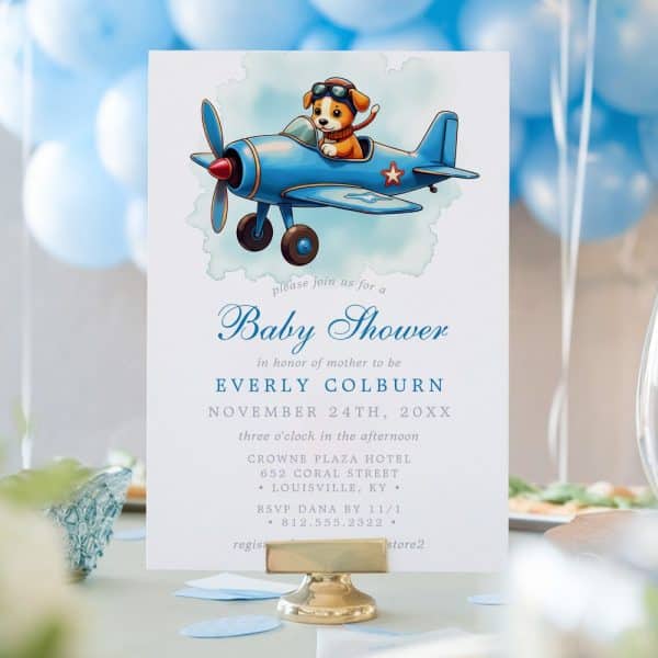 Baby Shower Invitation Featuring A Cartoon Puppy Piloting A Blue Airplane.