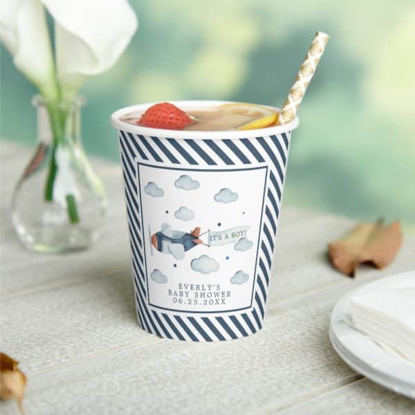 A Navy And White Striped Cup With A Baby Shower Design Featuring A Small Airplane And The Words Its A Boy.