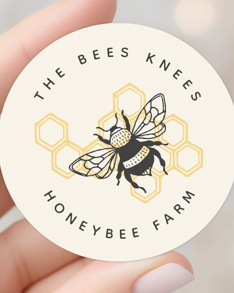 A round sticker featuring a bumblebee illustration centered on a honeycomb graphic. The text "The Bees Knees Honeybee Farm" circles the design.