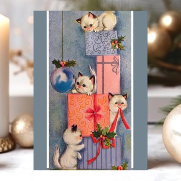 Four White Kittens Playing Around A Stack Of Christmas Presents.
