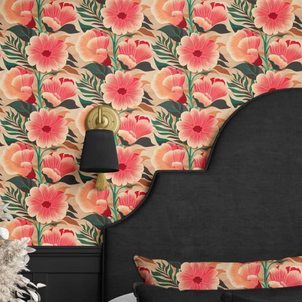 A Black Headboard Against A Wall Covered In A Large-Scale Coral And Peach Floral Wallpaper.