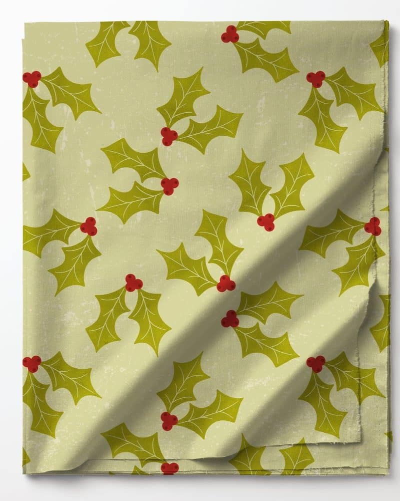Pale green fabric with a repeating pattern of olive green holly leaves and red berries.