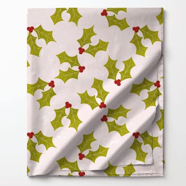 Pink Fabric With A Repeating Pattern Of Green Holly Leaves And Red Berries.