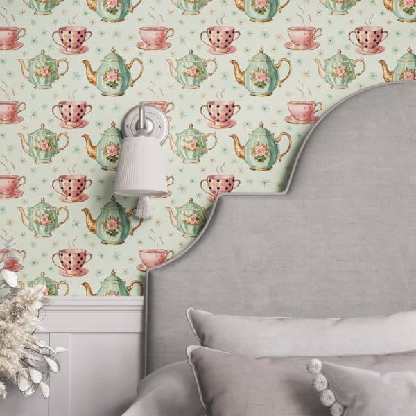 A Light Green Wall With A Repeating Pattern Of Teacups And Teapots. A Gray Headboard Partially Obscures The Wallpaper.