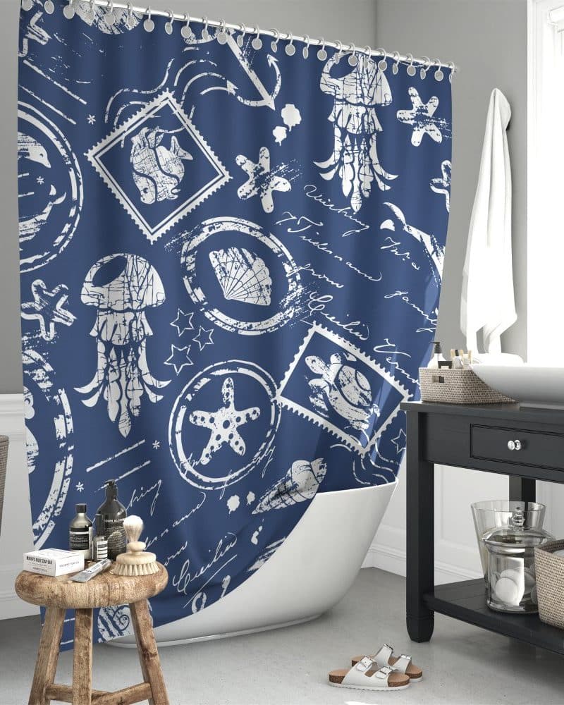 Navy blue shower curtain with a white sea life and postage stamp pattern.