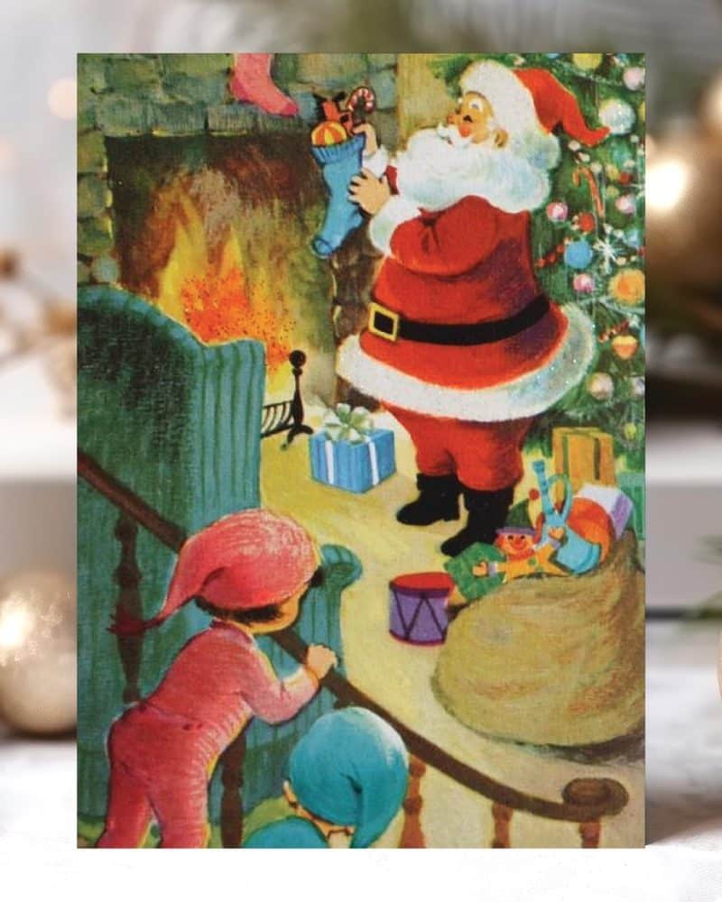 Santa Claus fills stockings by a fireplace, watched by two children in pajamas.