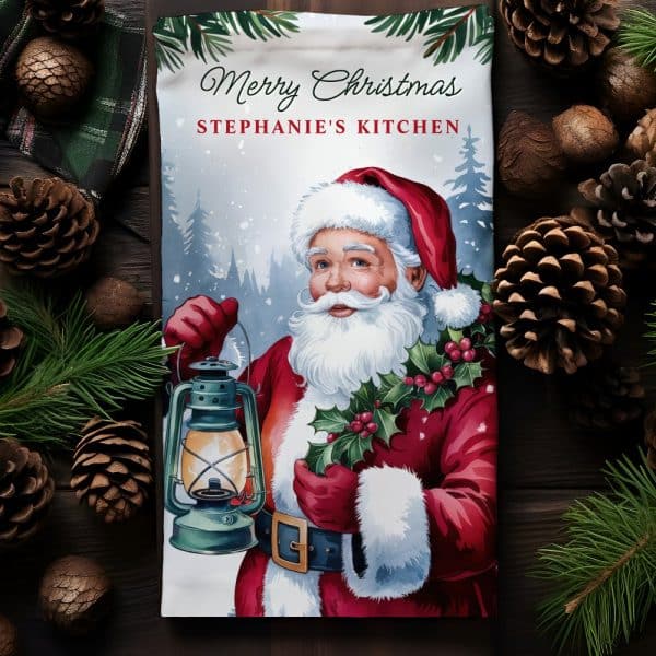 Christmas Kitchen Towel Featuring A Vintage Illustration Of Santa Claus Holding A Lantern.