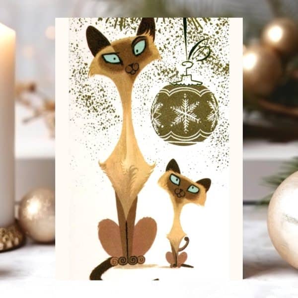 Christmas Card Featuring Two Stylized Siamese Cats Sitting Near A Hanging Ornament.