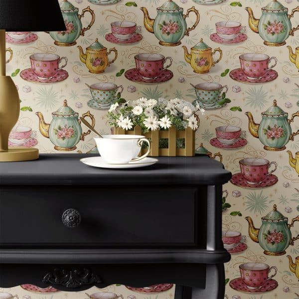 A Teacup And Saucer Sit On A Dark Wooden Side Table Against A Wall Covered In Tea-Themed Wallpaper.