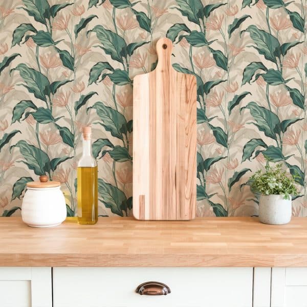 A Wooden Cutting Board Rests Against A Wall Covered In Teal And Peach Floral Wallpaper.