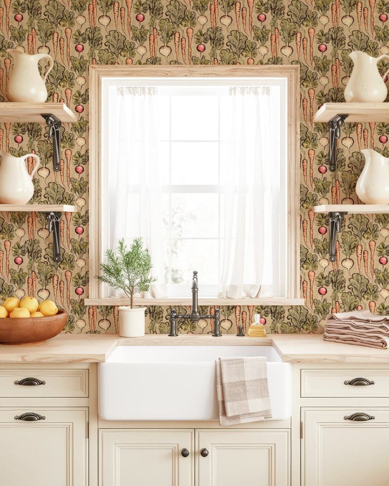 Kitchen sink and counter with vegetable wallpaper.