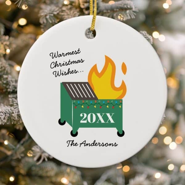 Round Christmas Ornament With A Dumpster Fire Illustration, Christmas Lights, And The Text Warmest Christmas Wishes, 20Xx, And The Andersons.