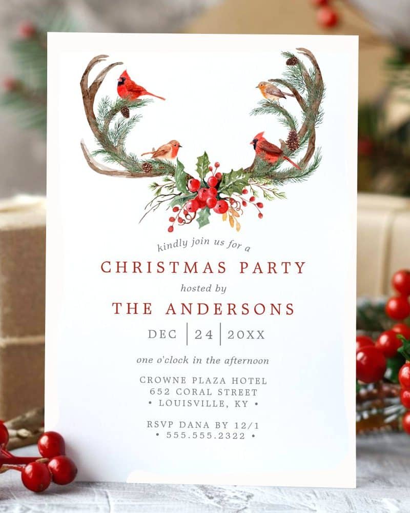 Christmas party invitation with a watercolor design of antlers, birds, and berries.