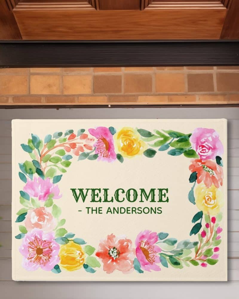 Floral welcome mat with the Andersons family name.