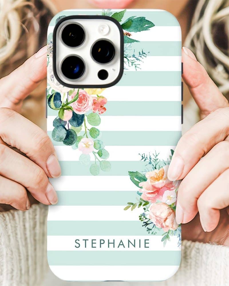 A mint green and white striped iPhone case with watercolor floral designs and the name Stephanie.