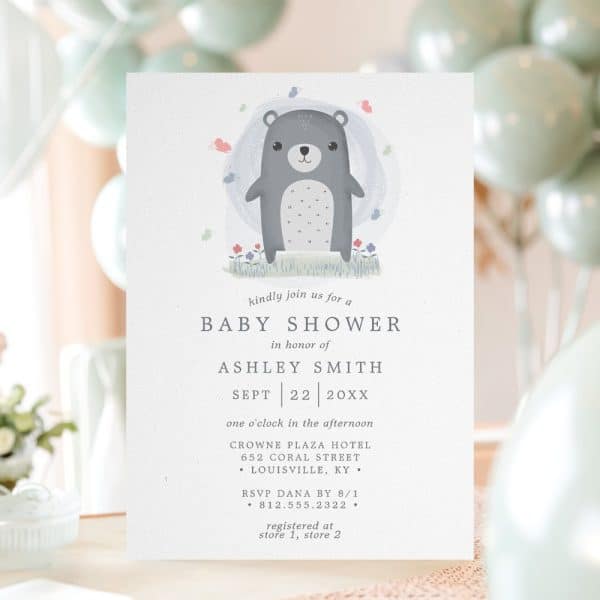 Baby Shower Invitation Featuring A Gray Bear In A Field Of Flowers.