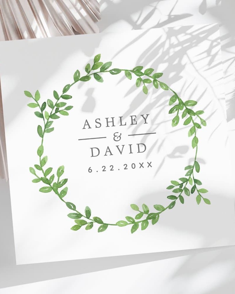 Wedding announcement with Ashley and David's names and date, framed by a leafy wreath.