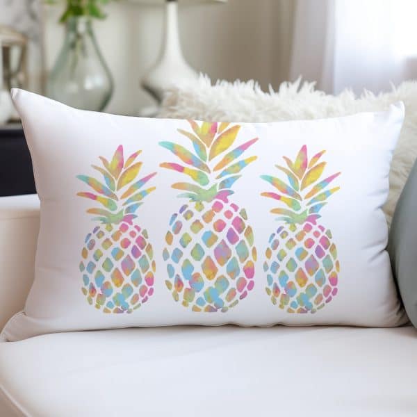 White Rectangular Pillow With Three Pastel Watercolor Pineapples.
