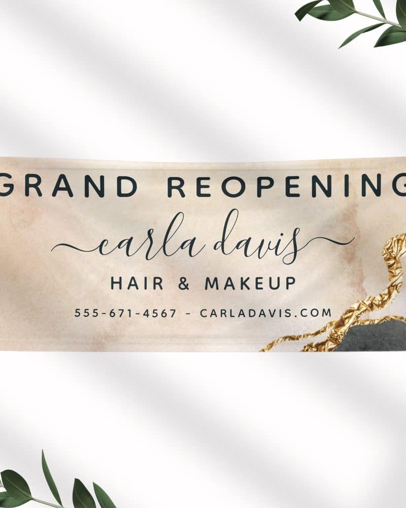 Grand reopening announcement for Carla Davis Hair & Makeup, including contact information.