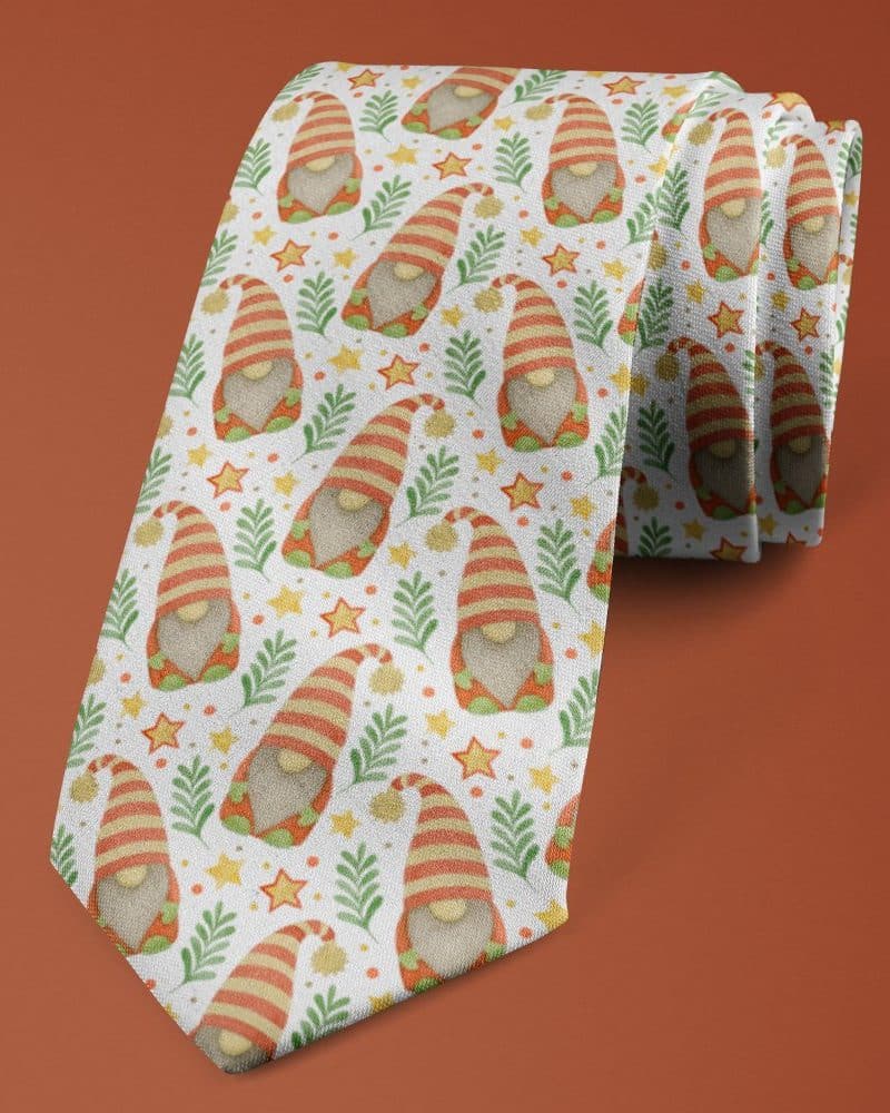 A necktie with a repeating pattern of gnomes, stars, and greenery.