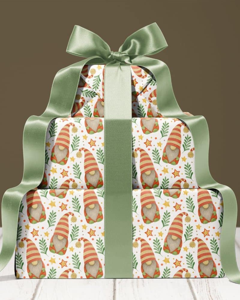 Stack of gifts wrapped in gnome-patterned paper, tied with a green ribbon.