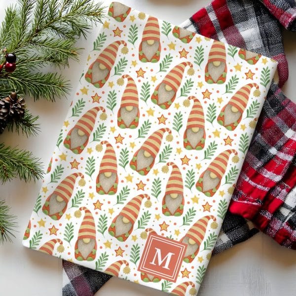 Wrapping Paper Featuring A Repeating Pattern Of Christmas Gnomes, Stars, And Greenery, Personalized With The Initial M.