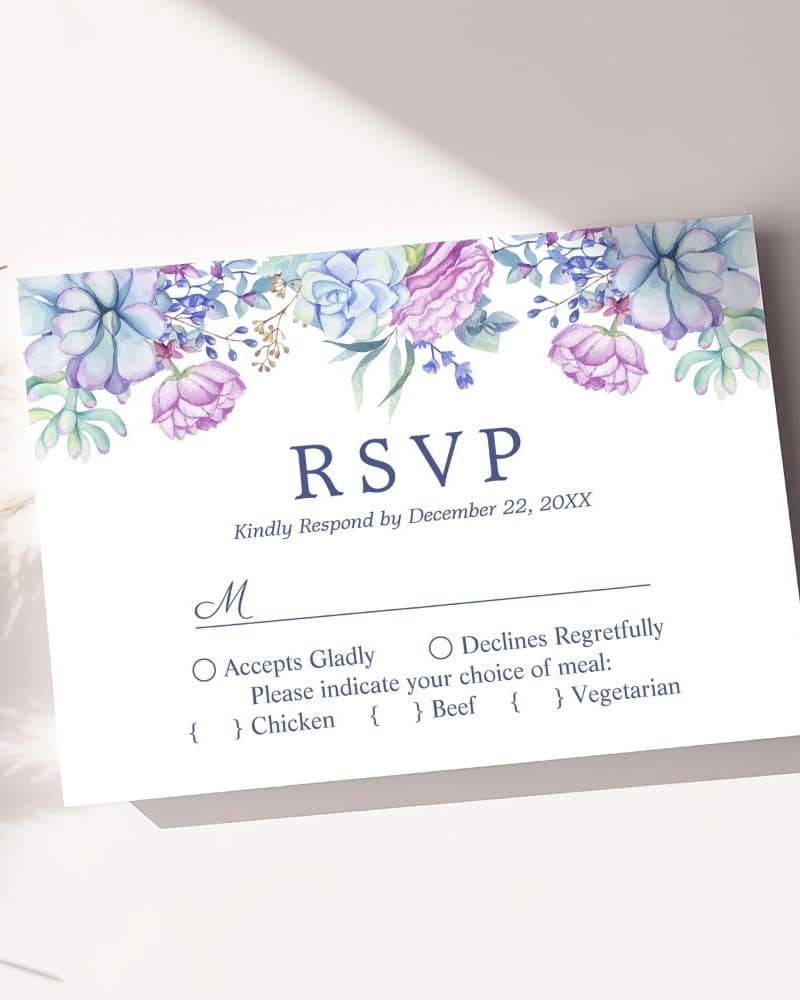 Floral RSVP card with options to accept or decline an invitation and meal choices.