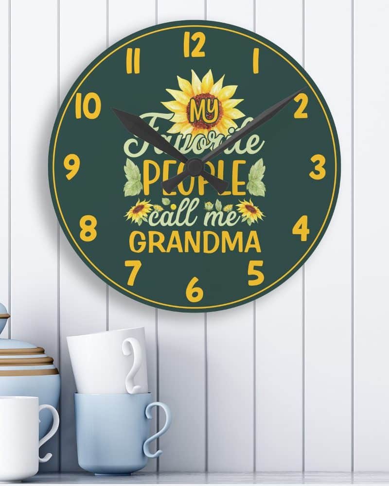 Dark green round clock with sunflowers and the text My Favorite People Call Me Grandma.