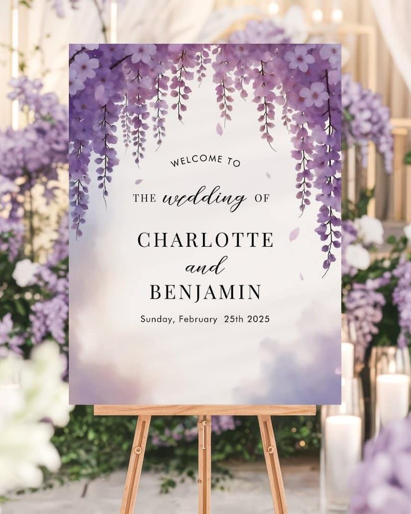 Wedding welcome sign with purple wisteria flowers, announcing Charlotte and Benjamin's wedding on February 25th, 2025.