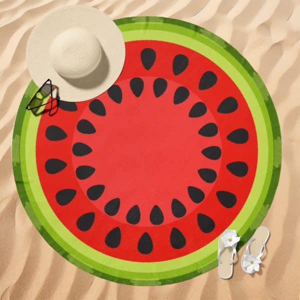 Round Watermelon-Patterned Beach Towel On Sand.