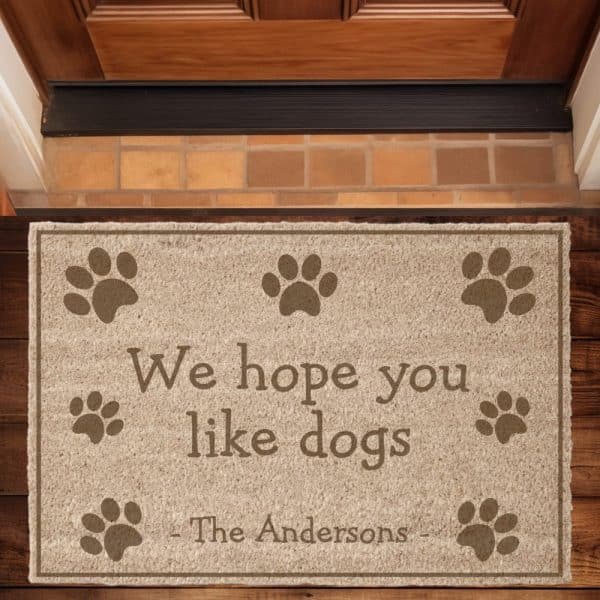 Tan Doormat With Paw Prints And The Text We Hope You Like Dogs, The Andersons.