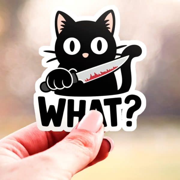 Black Cat Sticker Holding A Bloody Knife, Below Which Is The Word What.