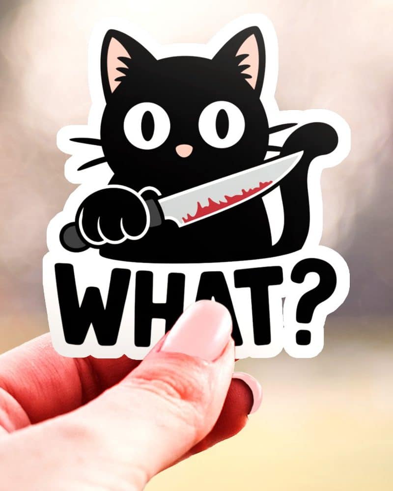 Black cat sticker holding a bloody knife, below which is the word WHAT.