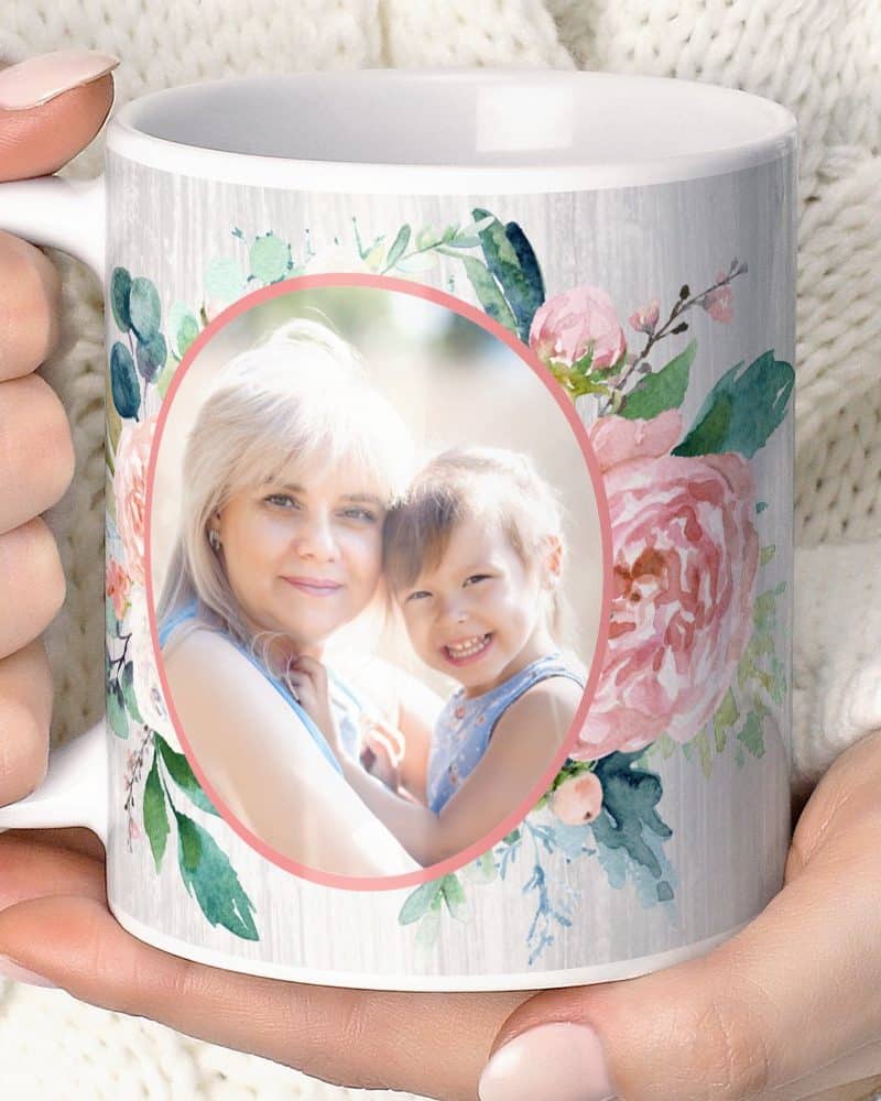 Coffee mug featuring a photo of a woman and young girl surrounded by pink flowers.