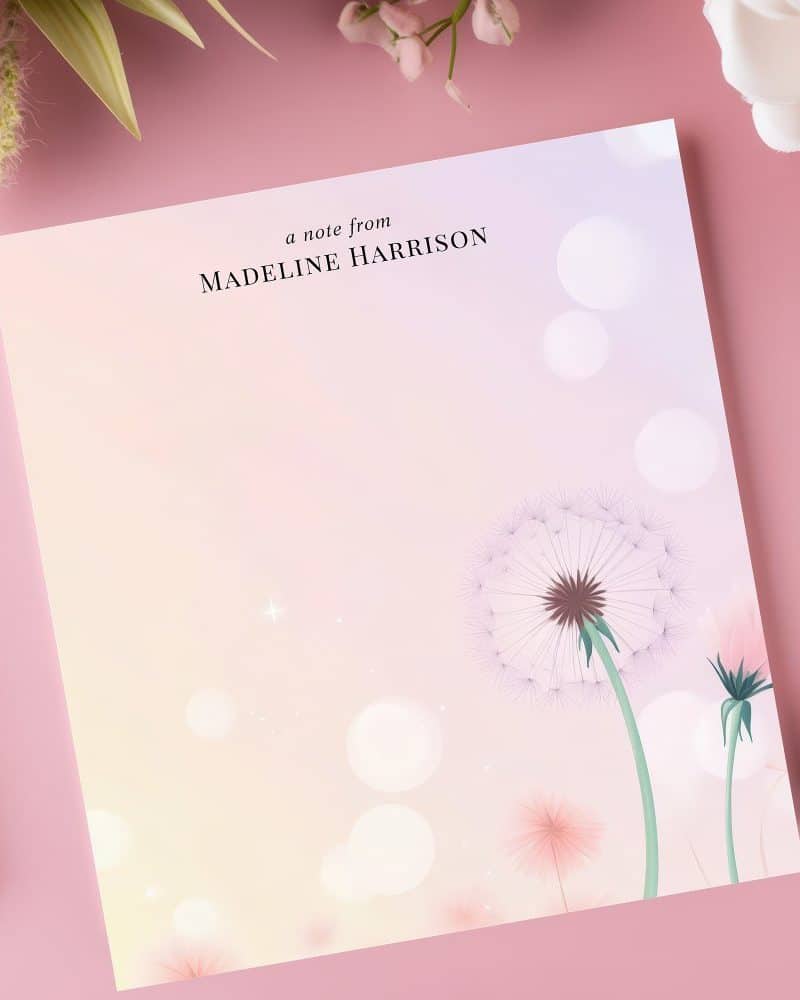 Personalized notepad featuring dandelions on a pastel background.