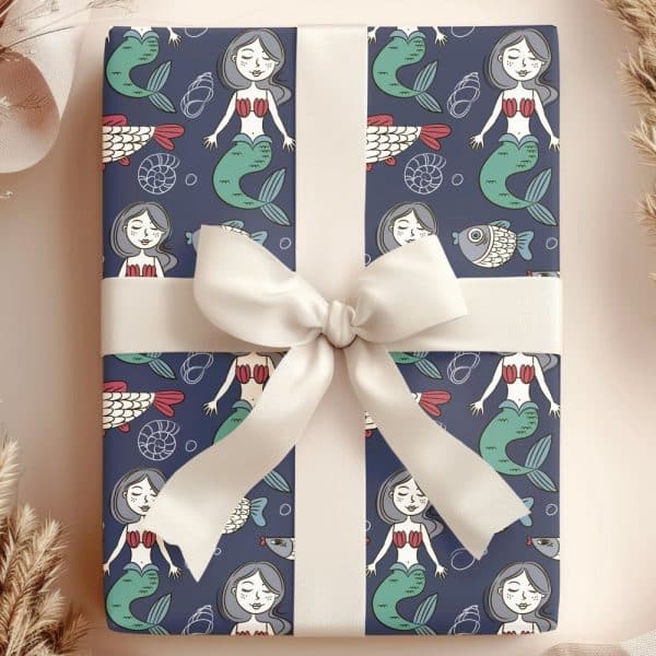 Gift Wrapped In Blue Mermaid-Themed Wrapping Paper With A Cream-Colored Bow.