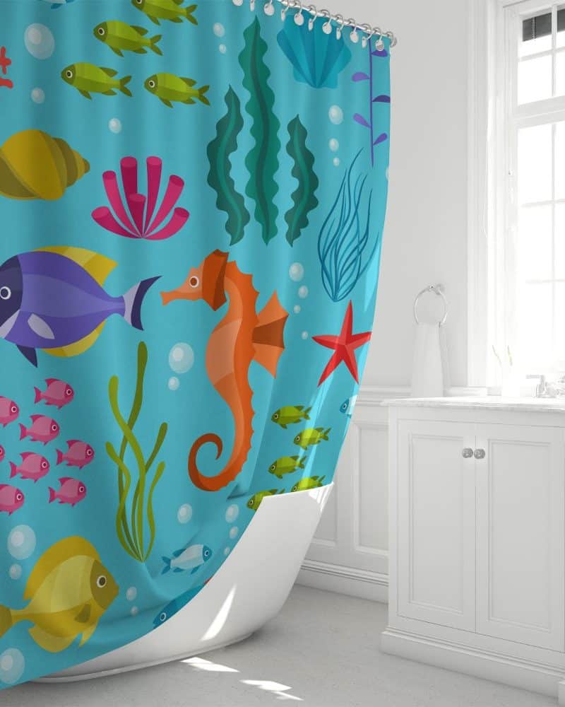 A light blue shower curtain with a colorful sea life pattern, featuring fish, a seahorse, and other aquatic plants and animals.