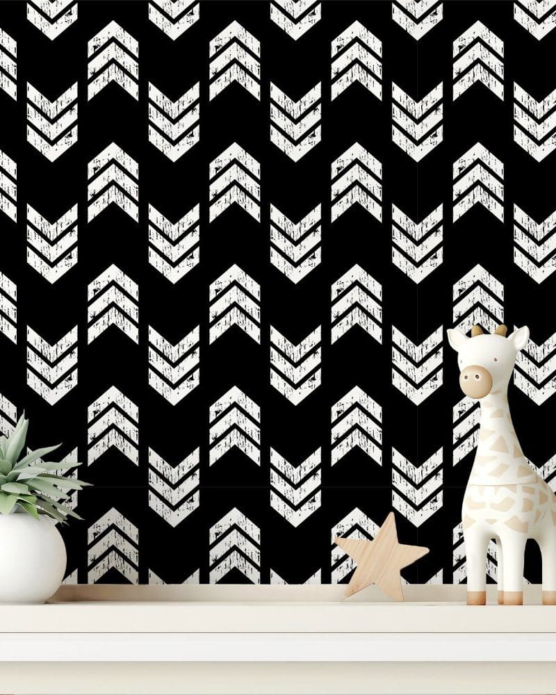 White distressed chevron arrows on a black background.