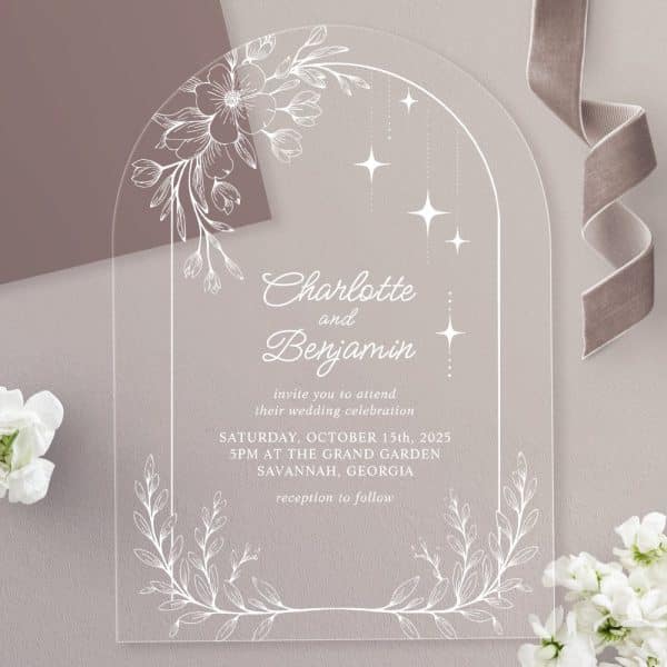 Clear Acrylic Wedding Invitation With Floral And Star Accents, Announcing Charlotte And Benjamin'S Wedding.