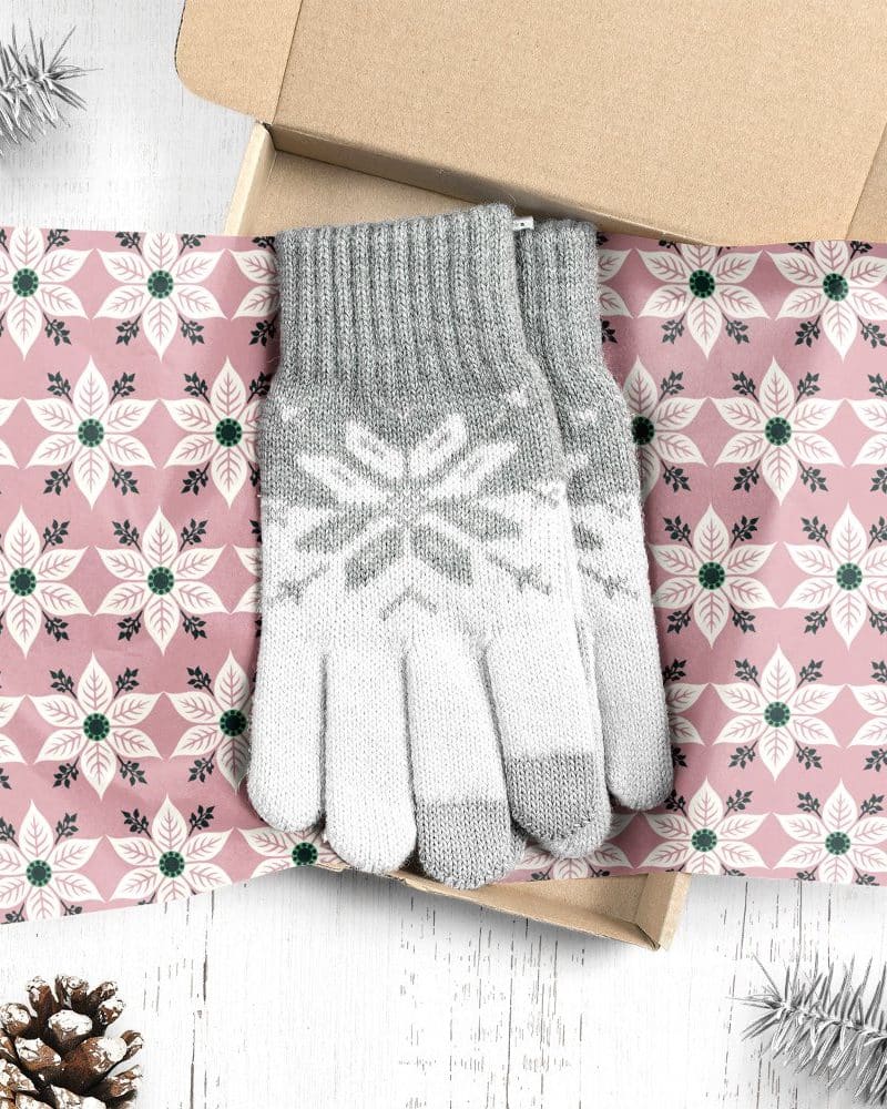 Pair of grey and white snowflake patterned gloves in a gift box.