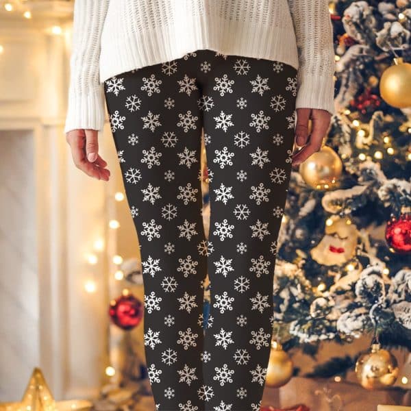 Dark Leggings With A White Snowflake Pattern.