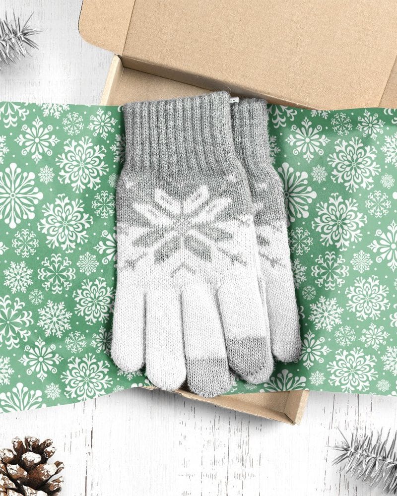 Pair of gray and white snowflake patterned gloves in a gift box.