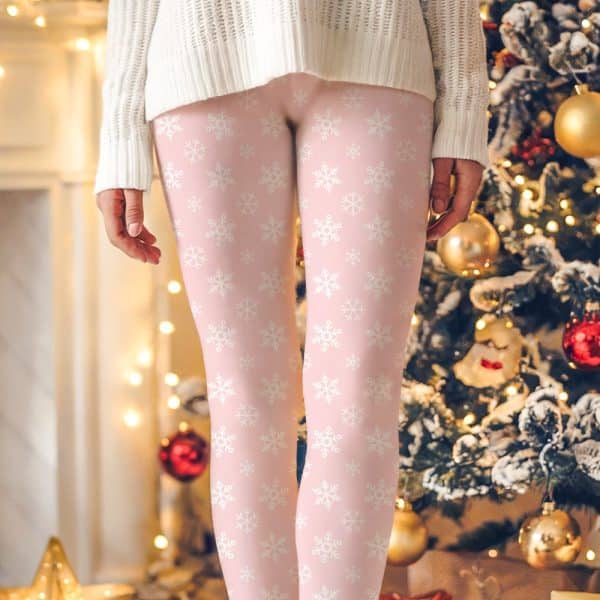 Pink Leggings With A White Snowflake Pattern.