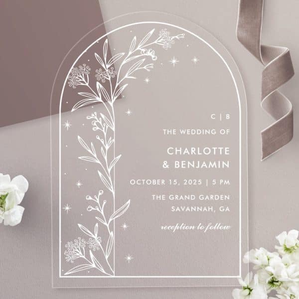Clear Acrylic Wedding Invitation With An Arched Top, Featuring A Line Drawing Of Floral Branches And Stars. The Invitation Announces Charlotte And Benjamin'S Wedding.