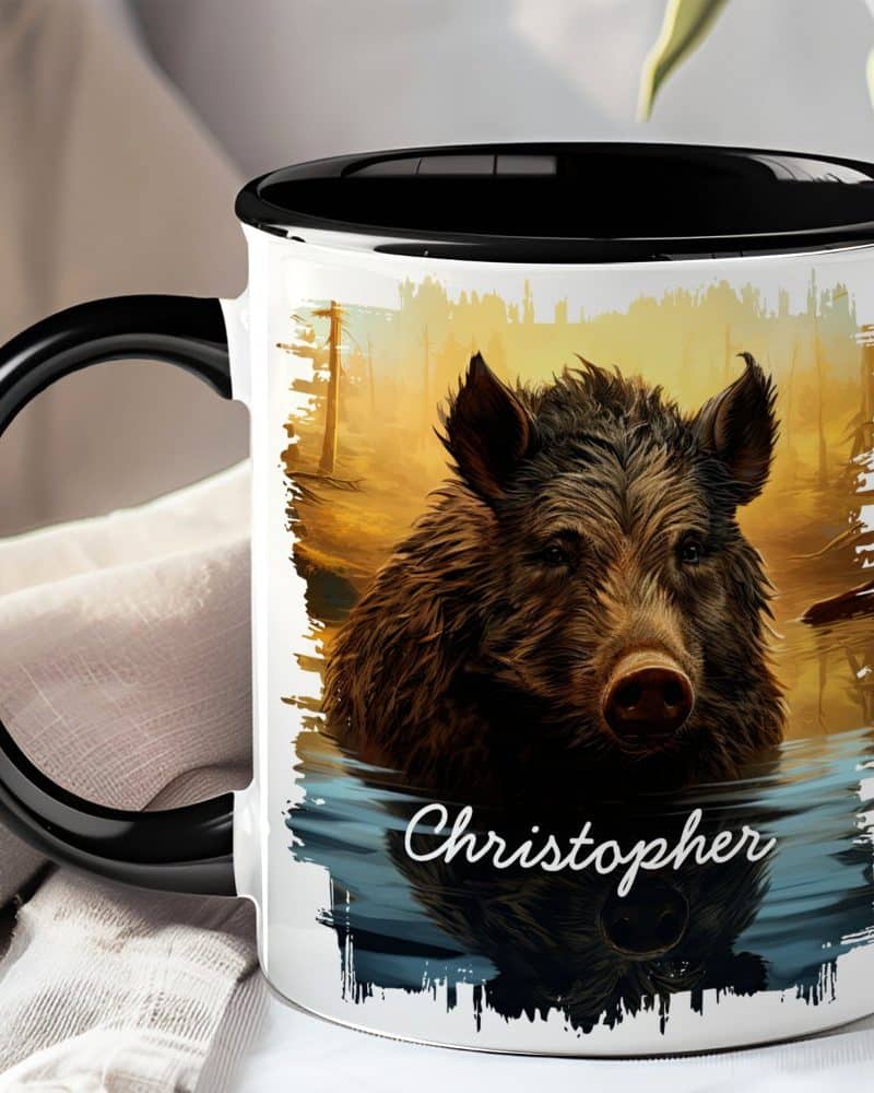 Black-handled mug with a personalized illustration of a wild boar's head emerging from water at sunset. The name Christopher is printed below.