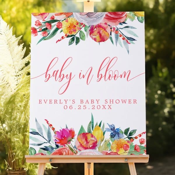 A Baby Shower Sign Featuring Watercolor Flowers And The Text Baby In Bloom, Everly'S Baby Shower, And The Date.