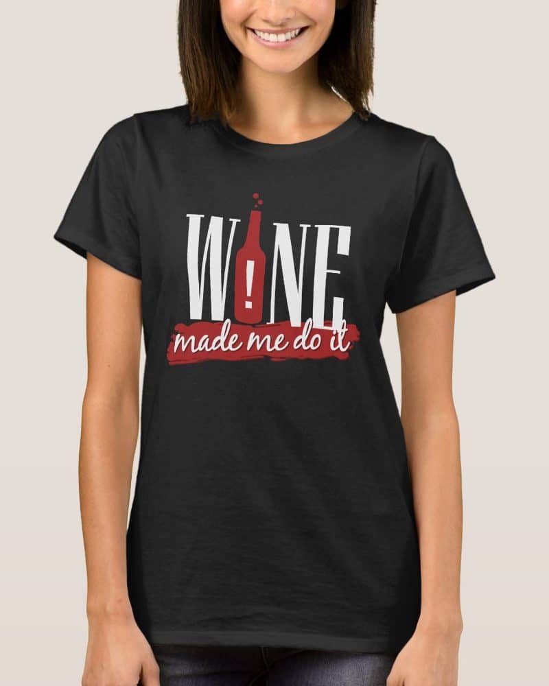 Woman wearing a black t-shirt that says Wine Made Me Do It.