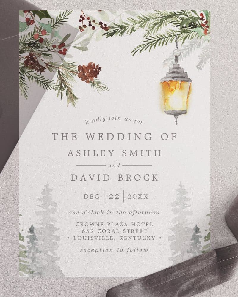 Wedding invitation for Ashley Smith and David Brock, featuring a winter scene with a lantern.